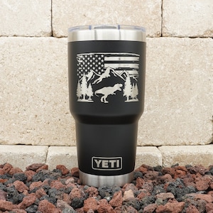 Laser Engraved YETI® or Polar Camel Tumbler - T-Rex Dinosaur with American Flag Outdoors Scene