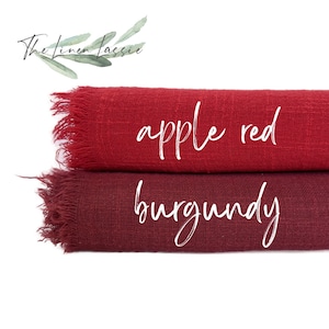 May include: Two fabric swatches, one apple red and one burgundy, with frayed edges. The Linen Lassie logo is visible in the top left corner.
