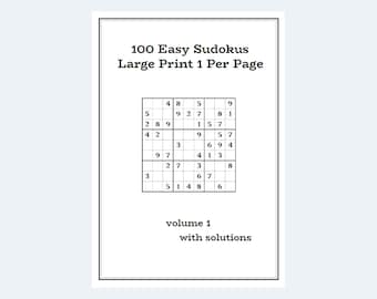 Peut inclure: Un sudoku noir et blanc avec les chiffres de 1 à 9. Le titre du livre est "100 Easy Sudokus Large Print 1 Per Page" et le sous-titre est "volume 1 with solutions".