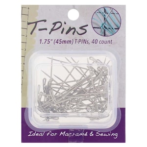 May include: A package of T-pins, 1.75 inches (45mm) long, with 40 pins. The package is clear plastic, and the pins are silver. The packaging has the text "T-Pins" and "Ideal for Macramé & Sewing".