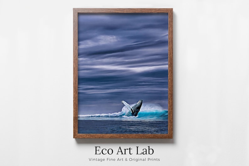 May include: A framed print featuring a breaching whale in a turquoise wave under a dramatic, cloudy sky. The artwork is set in a brown wooden frame. The text "Eco Art Lab" and "Vintage Fine Art & Original Prints" are at the bottom.
