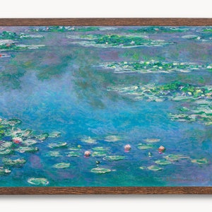 May include: A painting of a pond with water lilies and pink flowers. The water is a light blue color and the lilies are green. The painting is framed in a brown wood frame.