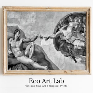 May include: Black and white framed print of Michelangelo's The Creation of Adam, a famous Renaissance painting depicting God reaching out to Adam. The print is in a simple wooden frame.