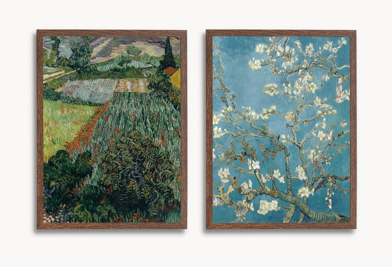 May include: Two framed paintings, one depicting a landscape with a field of green and red flowers, and the other a close-up of a white flowering tree against a blue sky.