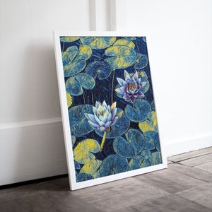 May include: A framed print of a blue and yellow abstract painting featuring two water lilies with purple centers. The lilies are surrounded by large, round, yellow-green leaves.