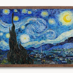 May include: A framed painting of a starry night sky with a crescent moon and a village in the foreground. The sky is painted in swirling blue and yellow hues with white stars. The village is painted in shades of blue and green.