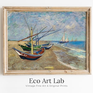 May include: A vintage painting of a seascape with several boats on a sandy beach. The sky is a light blue with white clouds. The boats are painted in shades of blue, green, and red. The painting is framed in a light wood frame.