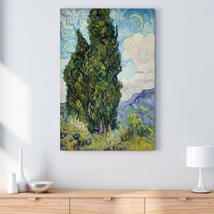 May include: A painting of a tall, green cypress tree against a blue and white sky. The tree is painted in a swirling, expressive style, characteristic of Vincent van Gogh. The background features rolling hills and a cloudy sky.