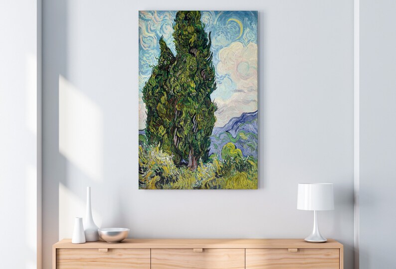 May include: A painting of a tall, green cypress tree against a blue and white sky. The tree is painted in a swirling, expressive style, characteristic of Vincent van Gogh. The background features rolling hills and a cloudy sky.