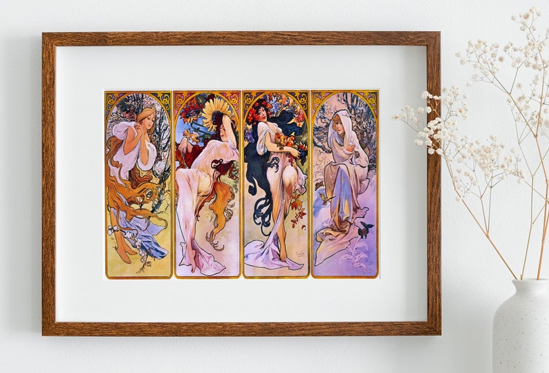 May include: A framed print of a vintage art nouveau illustration depicting four women representing the four seasons. Each woman is dressed in flowing robes and surrounded by flowers and foliage. The colours are vibrant and the artwork is detailed.