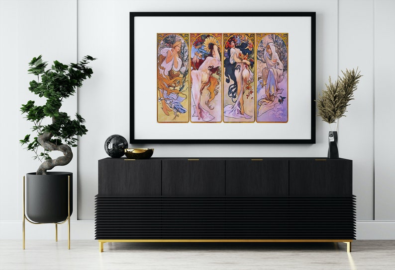 May include: A framed print depicting four women representing the four seasons. Each woman is shown in a different colour scheme and surrounded by flowers and foliage. The print is in a black frame and is hanging on a white wall.