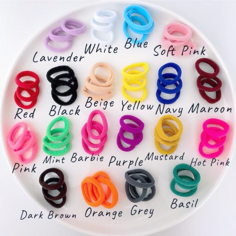 May include: Assortment of 16 colors of hair elastics, including white, blue, soft pink, lavender, red, black, beige, yellow, navy, maroon, mint, barbie pink, purple, mustard, hot pink, dark brown, orange, and grey.