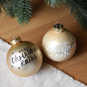 Personalized Christmas ornament with custom text | gold/champagne matte or glossy glass, 8 cm | individually hand-lettered