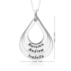 May include: A silver-colored teardrop-shaped pendant necklace featuring three stacked layers engraved with the names Autumn, Andrew, and Isabella. The pendant measures 0.86 inches in height and 0.63 inches in width, suspended from a thin chain.