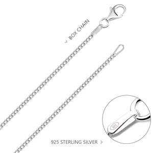 May include: A silver box chain necklace featuring a lobster claw clasp. The chain is made of 925 sterling silver, as indicated by the hallmark on the clasp. The design consists of square-shaped links connected in a continuous, uniform pattern.