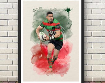 May include: A framed watercolor print of a rugby player in action, holding a rugby ball. The player is wearing a green, red, and white jersey and black shorts. The background features green and red watercolor splashes. The number 6 is visible.