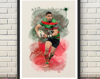 May include: A framed art print featuring a watercolor-style illustration of a rugby player in a red, green, and black jersey holding a ball. The player wears matching socks and black shorts. The text #6 Cody Walker is visible on the lower left.