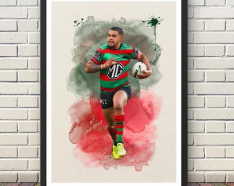 May include: A framed art print featuring a watercolor-style illustration of a rugby player in a red, green, and black jersey running with a white ball. The player wears matching shorts and socks. Text includes #7 and Latrell Mitchell.