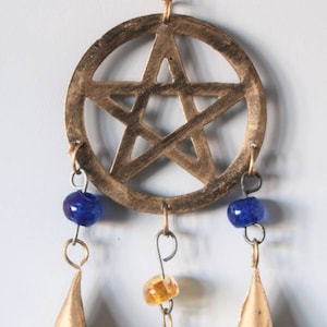 Golden hanging pentagram metal wall decor