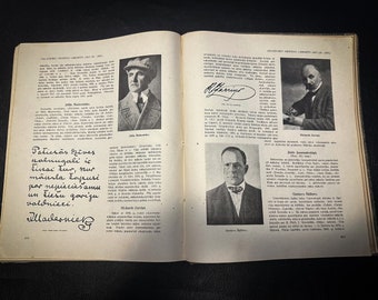 May include: An open book with black and white portraits and handwritten text. The book is open to two pages, each with a portrait and text. The text includes names and signatures. The book is on a dark surface.