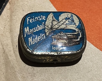 Caja metálica vintage para agujas de gramófono MARSCHALL con agujas originales. Artículo de colección raro. Publicidad vintage, audio retro, accesorios para fonógrafo.