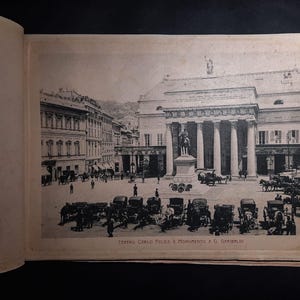 May include: A black and white photo of the Teatro Carlo Felice opera house in Genoa, Italy. The photo shows the front of the building with a statue of Giuseppe Garibaldi in front of it. The text "Teatro Carlo Felice e Monumento a G. Garibaldi" is printed below the image.