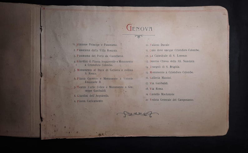 May include: A vintage, cream-colored, paper-bound book with a handwritten list of places to visit in Genoa, Italy. The list includes the "Stazione Principe" and "Palazzo Ducale".