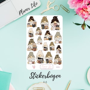 May include: A sheet of stickers featuring gnomes with coffee cups and mugs. The stickers are on a white background and have a brown, white, and black color scheme. The text "Planner Lilo" and "Stickerbogen A6" are printed on the sheet.