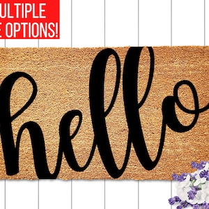 May include: A brown coir doormat with the word "hello" written in black cursive script.