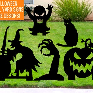 May include: Five black metal Halloween yard signs. The signs are cutouts of a witch stirring a cauldron, a pumpkin with a scary face, a cat, a monster with its arms raised, and a zombie hand. The signs are on a green lawn.