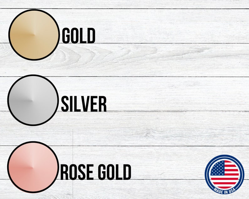 May include: Three round metal discs in gold, silver, and rose gold colors. The discs are arranged vertically on a white wood background. The text "GOLD", "SILVER", and "ROSE GOLD" is printed below each disc. A small American flag is in the lower right corner with the text "MADE IN USA".