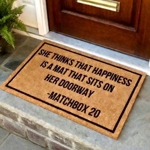 She thinks that happiness is a mat that sits on her doorway, matchbox 20 doormat, 90s gift, I love the 90s gift,  doormat for 90's kid