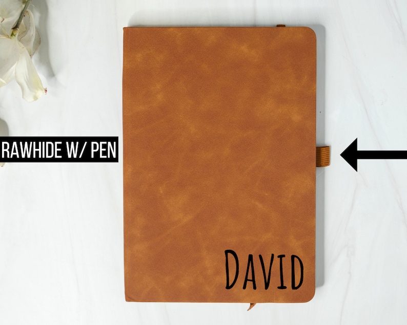 May include: A brown leather-bound journal with a pen loop and the name "DAVID" embossed on the front.