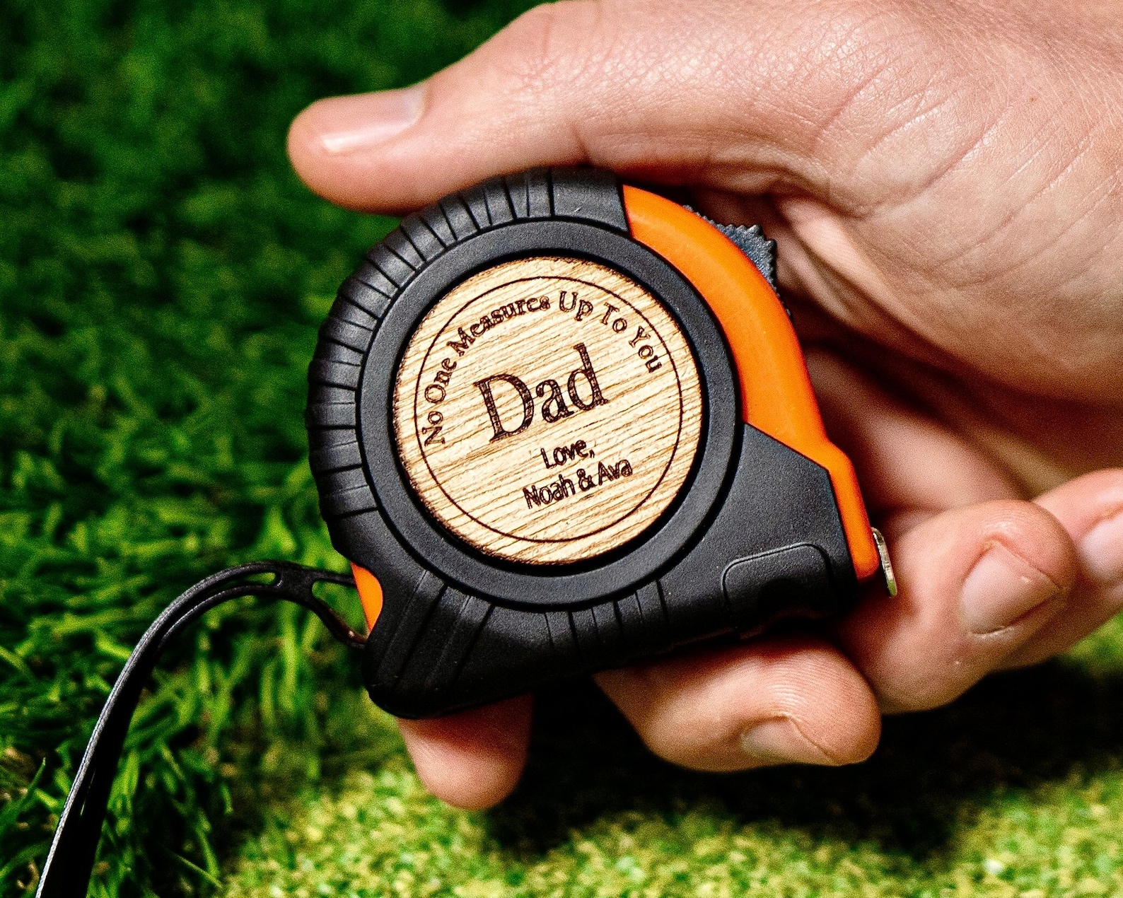 A measuring tape roll with an engraved message for Father's Day