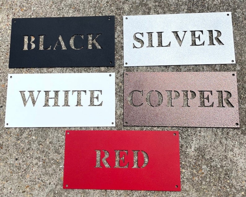 May include: Five metal signs with different colors and the words "BLACK", "SILVER", "WHITE", "COPPER", and "RED" cut out of the metal.