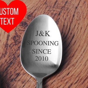 May include: A silver spoon with the text "J&K Spooning Since 2010" engraved on it.