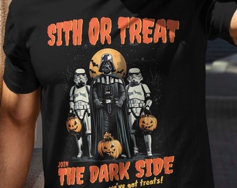 May include: A black t-shirt with a graphic of Darth Vader and two Stormtroopers dressed in Halloween costumes. The text "Sith or Treat" is above the graphic and "Join the Dark Side we've got treats!" is below the graphic.