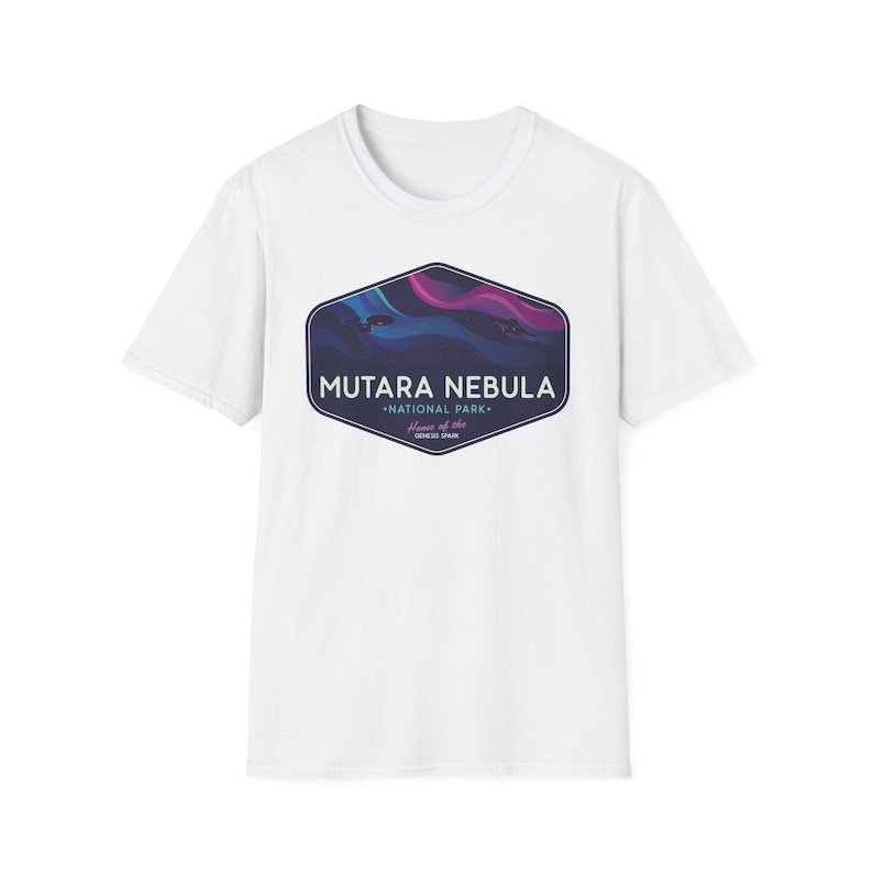 May include: White t-shirt featuring a graphic of the Mutara Nebula National Park. The design includes the text "Mutara Nebula" above "National Park" and "Home of the Gemini Span" in a dark blue, purple, and pink color scheme.