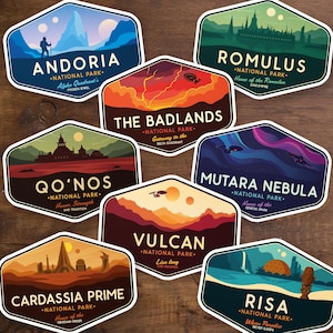 May include: A collection of eight hexagonal stickers featuring stylized landscapes and text. Each sticker is labeled with a location name, such as "Andoria" and "Vulcan", and the words "National Park". The stickers have a variety of color schemes and designs.