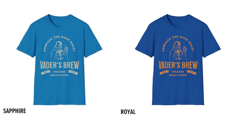 May include: Two blue t-shirts with a graphic of Darth Vader drinking coffee. The text on the shirts reads "Embrace the Dark Roast, Vader's Brew, Est. 1977, Unleash Bold Flavor".