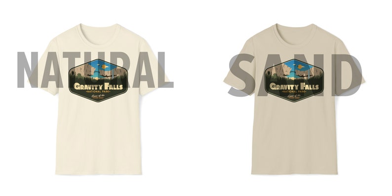 K&ouml;nnte beinhalten: Zwei T-Shirts mit einem Grafikdruck eines Gebirges und dem Text "Gravity Falls National Park" im Vintage-Stil. Die T-Shirts sind in den Farben Natur und Sand erh&auml;ltlich.
