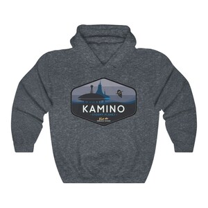 May include: A dark grey hooded sweatshirt with a graphic design of a city skyline and the text "KAMINO - STORMY PLANET -  Visit the ENDLESS OCEAN".
