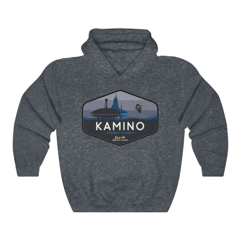 May include: A dark grey hooded sweatshirt with a graphic design of a city skyline and the text "KAMINO - STORMY PLANET -  Visit the ENDLESS OCEAN".