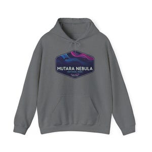 May include: A gray hooded sweatshirt with a front pocket and drawstring. The front features a graphic of the Mutara Nebula National Park with text. The graphic has a blue, purple, and pink color scheme.