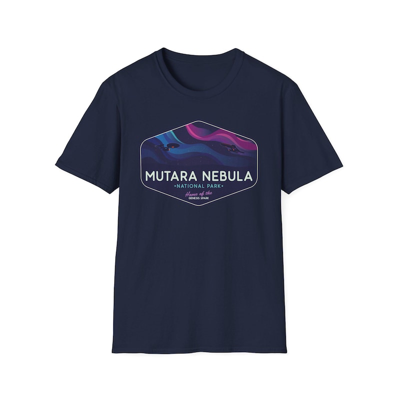 May include: Navy blue t-shirt featuring a graphic of the Mutara Nebula National Park. The graphic is a stylized depiction of a nebula with shades of blue, purple, and pink. Text on the graphic reads "Mutara Nebula National Park" and "Home of the Genesis Spire."
