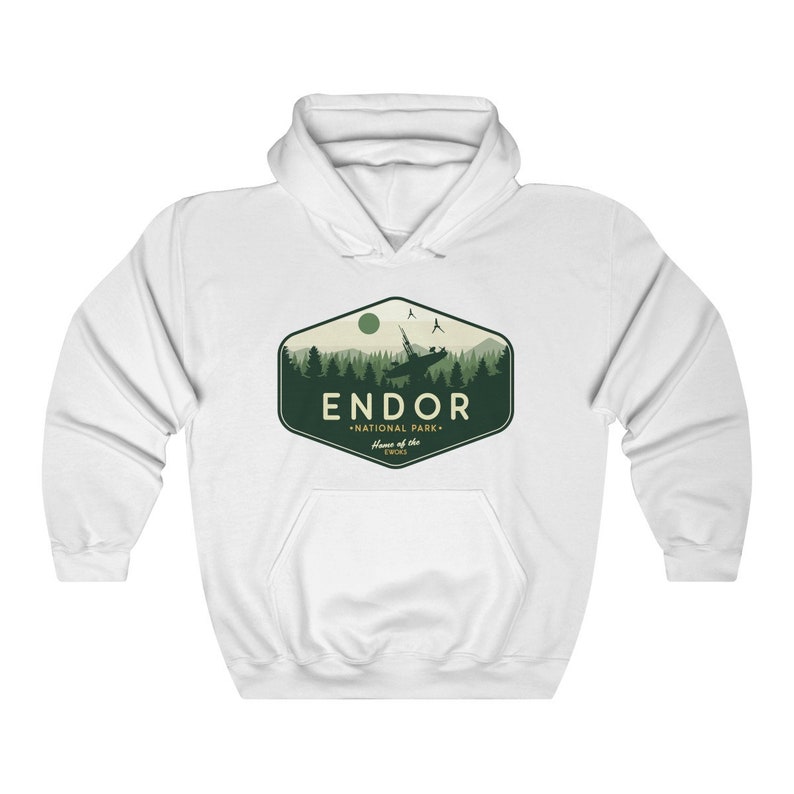 May include: White hooded sweatshirt with a green and white graphic design of a forest scene with a spaceship flying over it. The graphic says "Endor National Park - Home of the Ewoks".