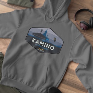 May include: Gray hooded sweatshirt with a blue and white graphic of a city on a planet with the text "Kamino - Stormy Planet - Visit the Endless Ocean".