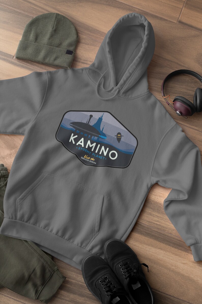 May include: Gray hooded sweatshirt with a blue and white graphic of a city on a planet with the text "Kamino - Stormy Planet - Visit the Endless Ocean".