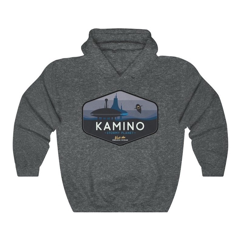 May include: A dark grey hooded sweatshirt with a graphic design of a blue and white cityscape with the text "KAMINO - STORMY PLANET -  Visit the ENDLESS OCEAN" in a blue and white hexagon.