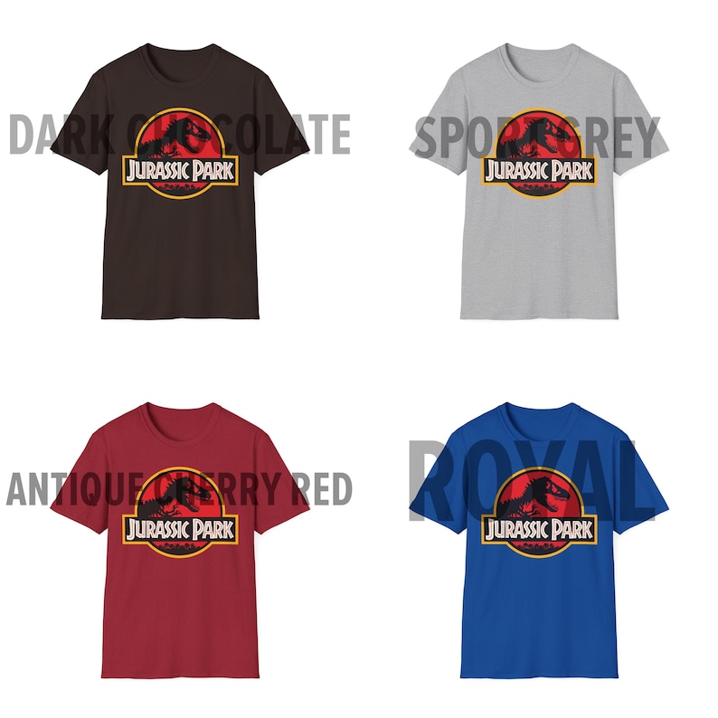 May include: Four short-sleeved t-shirts in dark chocolate, sport grey, antique cherry red, and royal blue. Each shirt features the Jurassic Park logo in a red circle with a yellow border. The text "JURASSIC PARK" is below the logo.